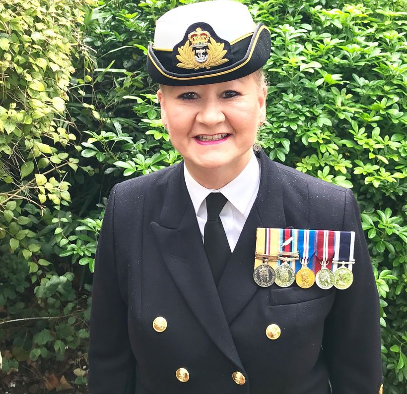 Julie Thain-Smith stands in uniform