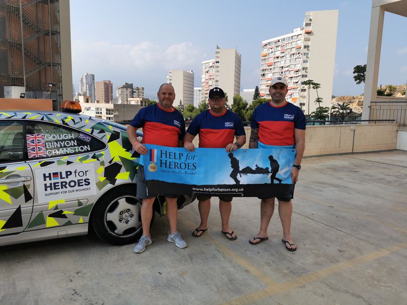 Help for Heroes team next to their car