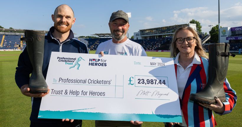 Large cheque held by trio